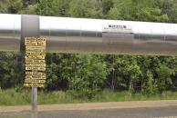 [Signpost by the pipeline]