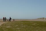 [People walking on beach by Abbotts Lagoon]