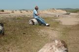 [Frank sitting on a log by Abbotts Lagoon]