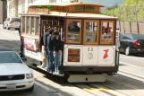 [People on a cable car in San Francisco]