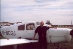 [Frank in front of a Piper Cherokee]