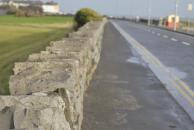 [Stone wall between Galway and Salthill, looking west to Galway]