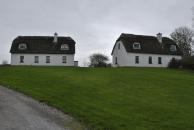 [Thatched roof houses]