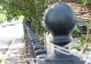 [top of the cemetary fence (left)]