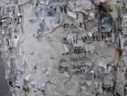 [Close-up of telephone pole with remants of posting]