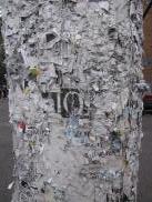 [Close-up of telephone pole with remants of posting]